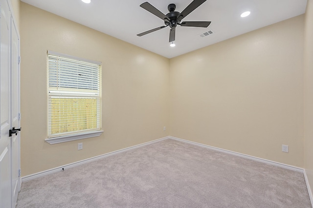 carpeted empty room with ceiling fan