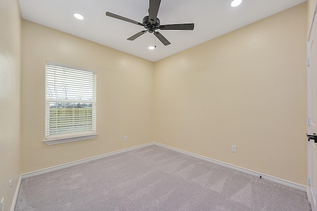 carpeted empty room with ceiling fan