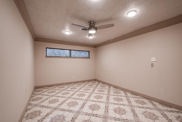 empty room with ceiling fan, crown molding, and a textured ceiling