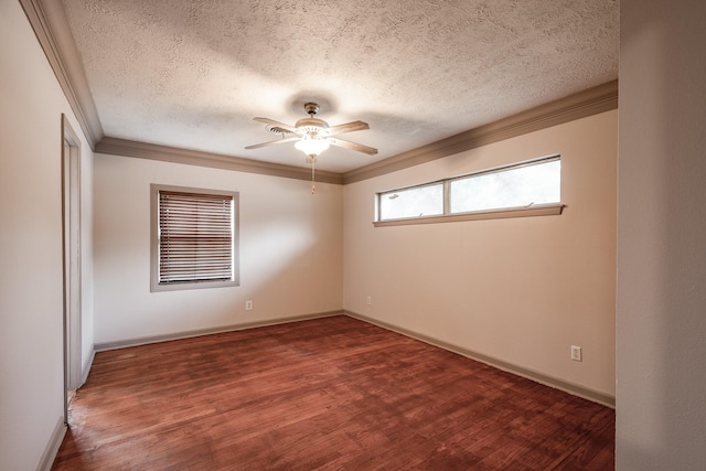 spare room featuring crown molding, ceiling fan, dark hardwood / wood-style flooring, and a textured ceiling