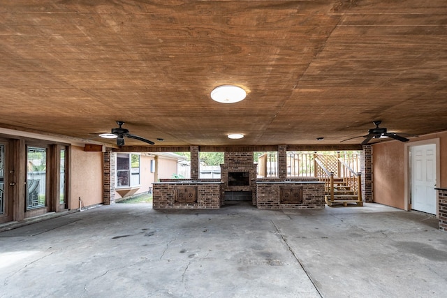 view of patio featuring area for grilling, exterior fireplace, and ceiling fan