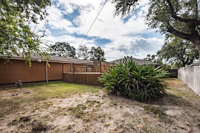 view of yard featuring a deck