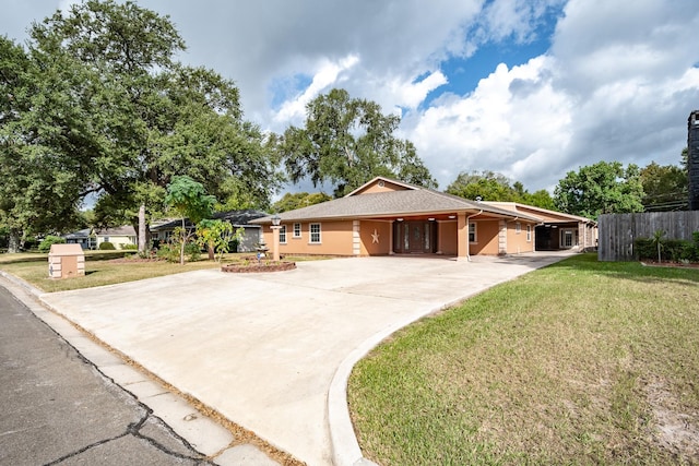 ranch-style house with a front lawn and a carport