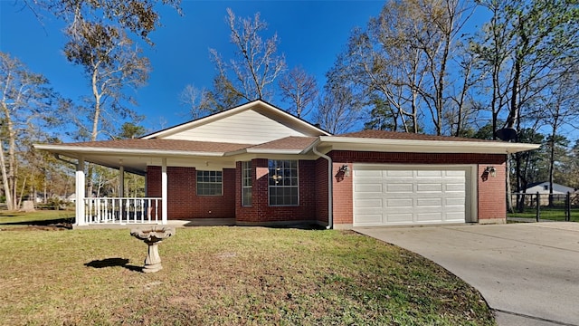 ranch-style house featuring a front yard, a garage, and covered porch