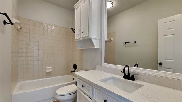 full bathroom with vanity, toilet, and tiled shower / bath