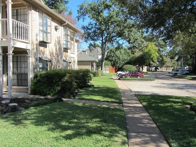 surrounding community featuring a lawn