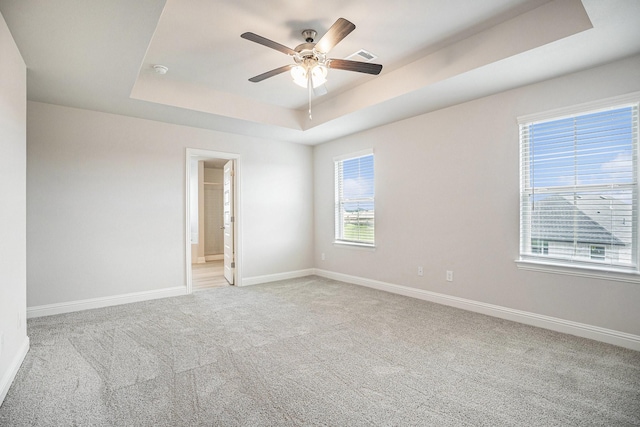 5307 W Bayou Maison Cir, Dickinson, TX 77539 - empty room with a raised ceiling, light carpet, a ceiling fan, and a smoke detector