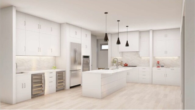 kitchen with hanging light fixtures, stainless steel fridge, a center island with sink, and beverage cooler