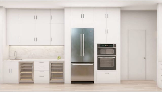 kitchen featuring wine cooler, stainless steel fridge, sink, and double wall oven