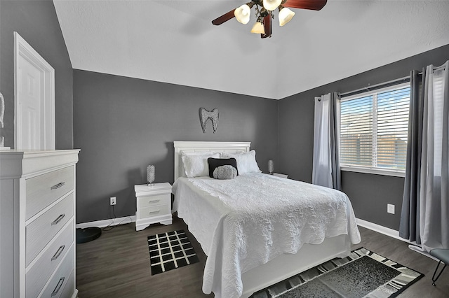 bedroom with ceiling fan and dark hardwood / wood-style floors