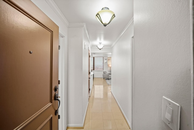 hallway featuring crown molding and light tile patterned flooring