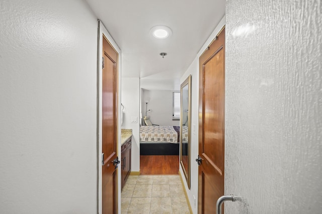 hallway with light tile patterned flooring