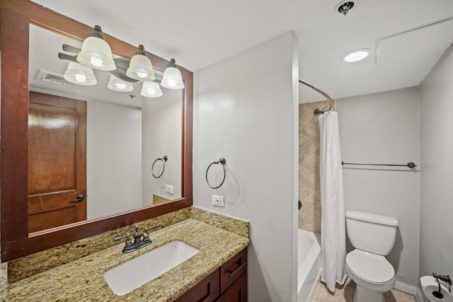 full bathroom with vanity, toilet, and shower / bath combo with shower curtain