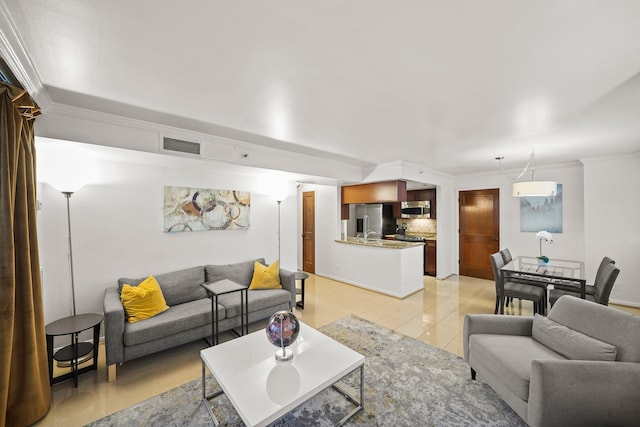 tiled living room featuring crown molding