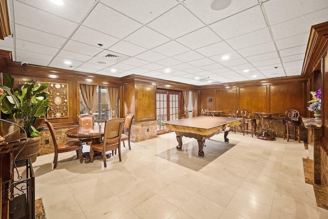 rec room featuring pool table, a paneled ceiling, and wooden walls