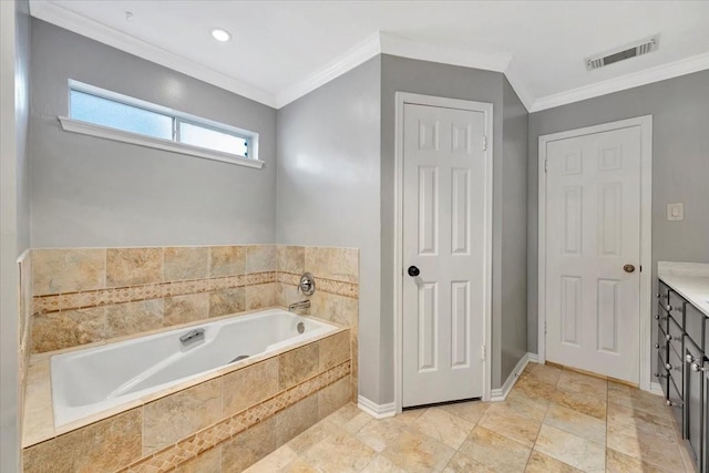 bathroom with vanity, ornamental molding, and tiled tub