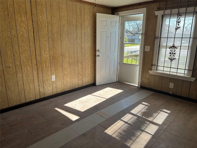 interior space featuring dark hardwood / wood-style flooring and wood walls