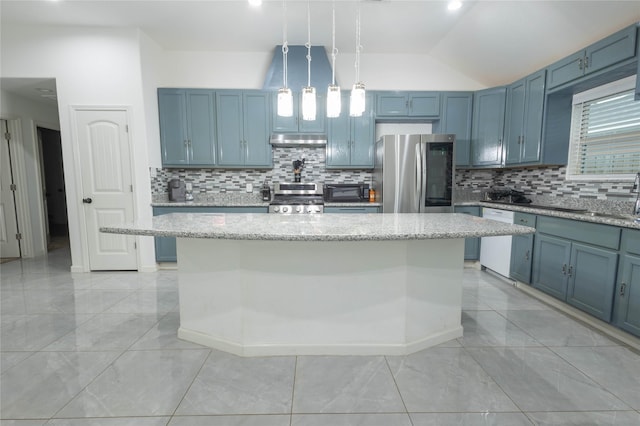 kitchen featuring a kitchen island, light stone counters, hanging light fixtures, and appliances with stainless steel finishes