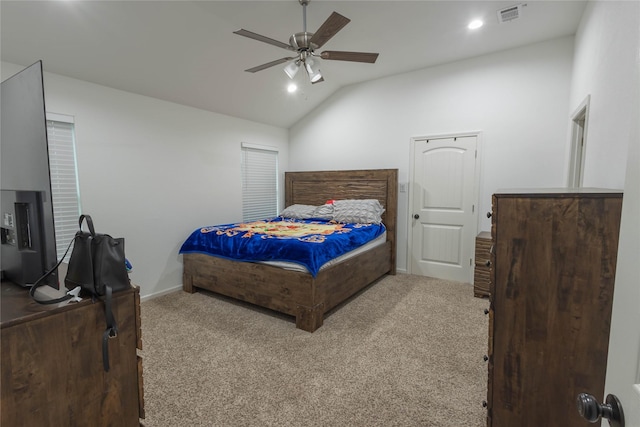 carpeted bedroom featuring ceiling fan and lofted ceiling