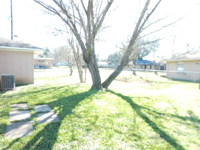 view of yard featuring central air condition unit