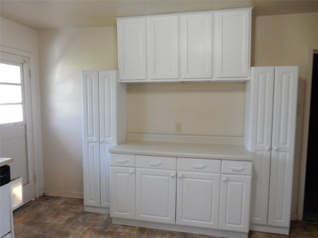 kitchen featuring white cabinetry