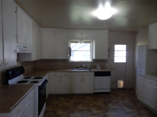 kitchen with white appliances, white cabinetry, a wealth of natural light, and sink