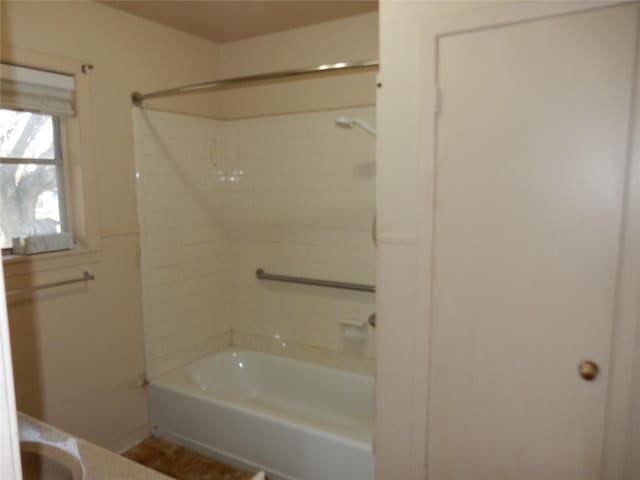 bathroom with shower / bathtub combination