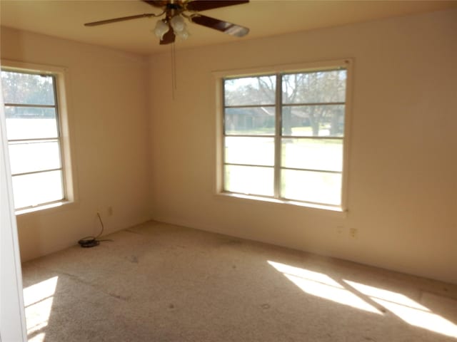 unfurnished room featuring carpet floors and ceiling fan