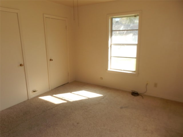 unfurnished bedroom featuring carpet flooring