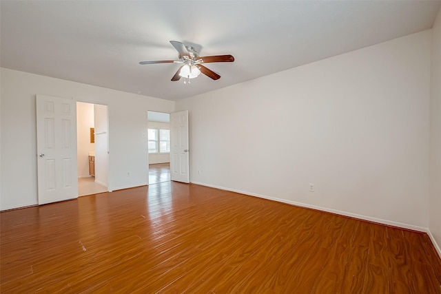 unfurnished room featuring ceiling fan and hardwood / wood-style floors