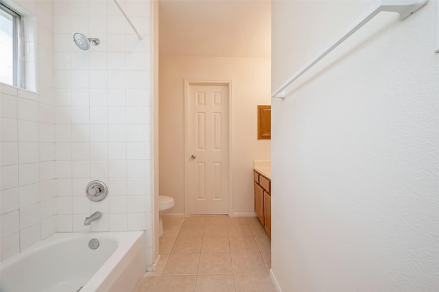 full bathroom with tile patterned floors, vanity, toilet, and tiled shower / bath combo