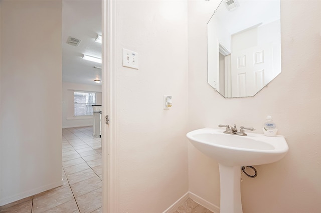 bathroom with tile patterned floors