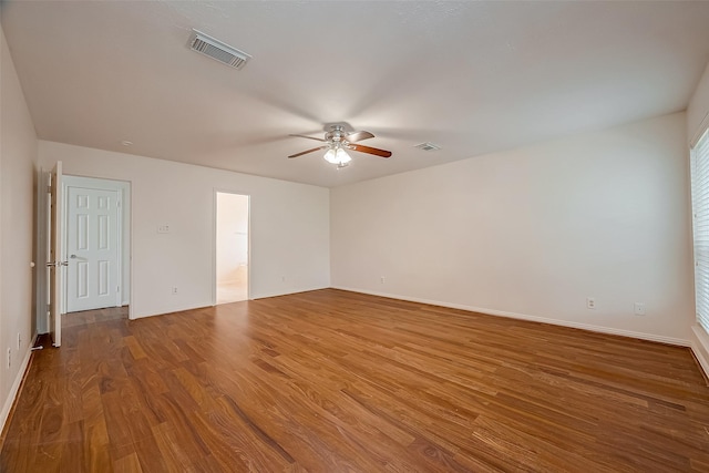 spare room featuring hardwood / wood-style flooring and ceiling fan