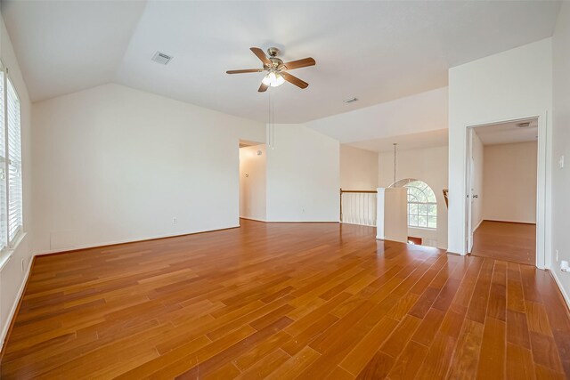 spare room featuring hardwood / wood-style flooring, vaulted ceiling, and ceiling fan