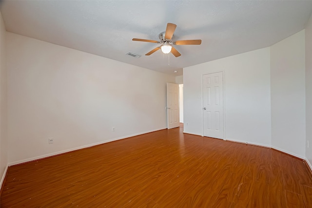 unfurnished room featuring ceiling fan and hardwood / wood-style floors