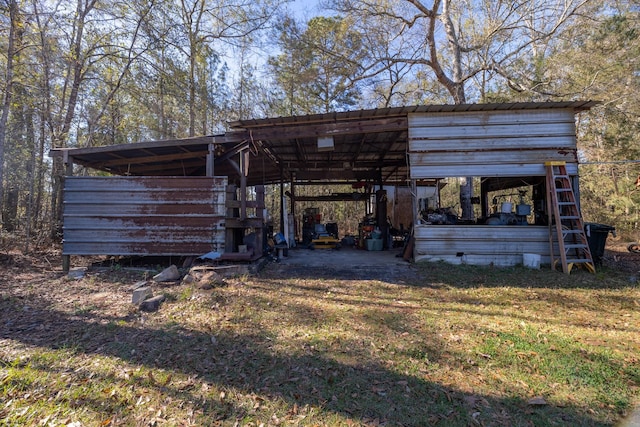 view of outbuilding featuring a yard