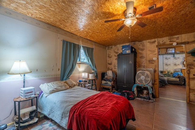 bedroom with wood-type flooring and ceiling fan