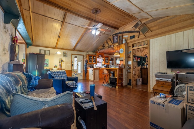 living room featuring ceiling fan, wooden ceiling, dark hardwood / wood-style flooring, vaulted ceiling, and wooden walls