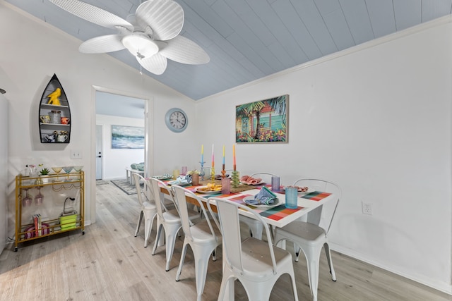 dining area featuring lofted ceiling, crown molding, ceiling fan, light hardwood / wood-style floors, and wood ceiling