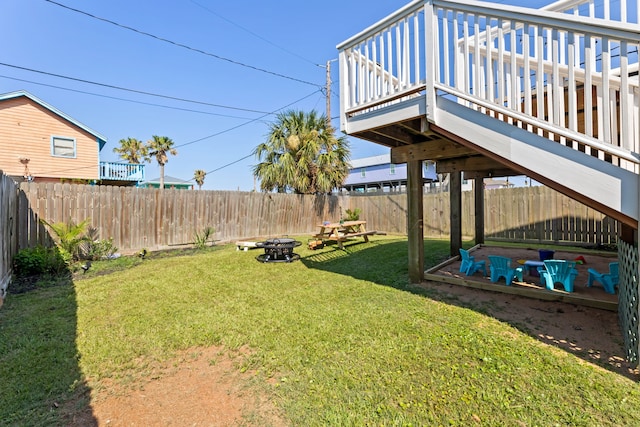 view of yard with a fire pit and a wooden deck