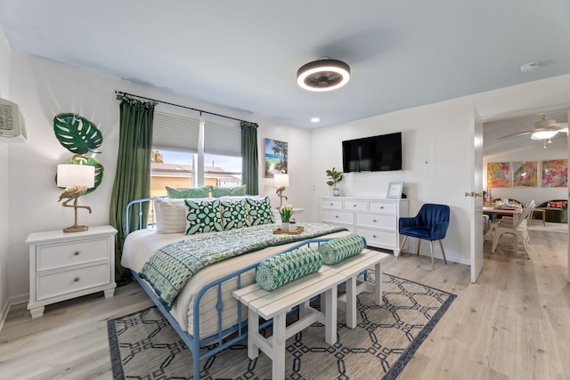 bedroom featuring ceiling fan and light hardwood / wood-style floors