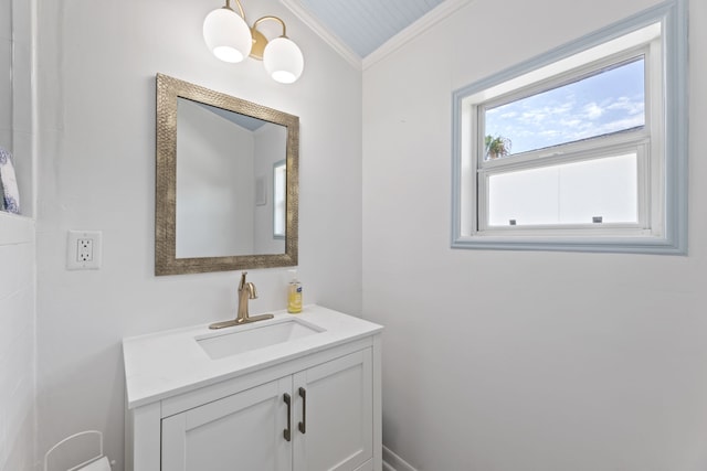 bathroom with crown molding and vanity