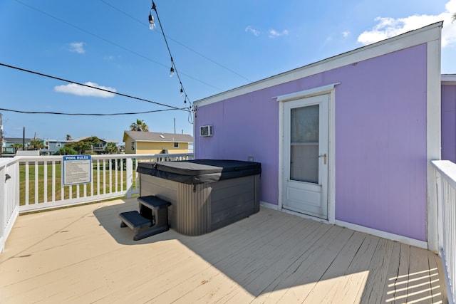 deck featuring a hot tub