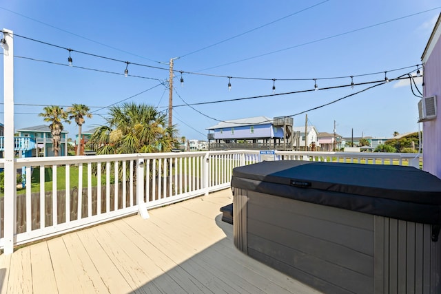 deck featuring a hot tub