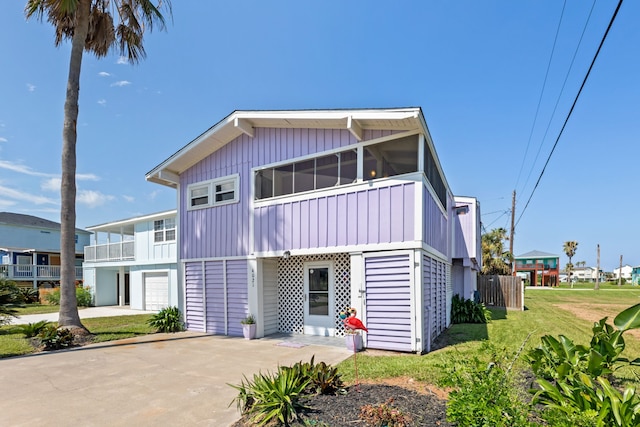 view of front facade with a front yard and a garage