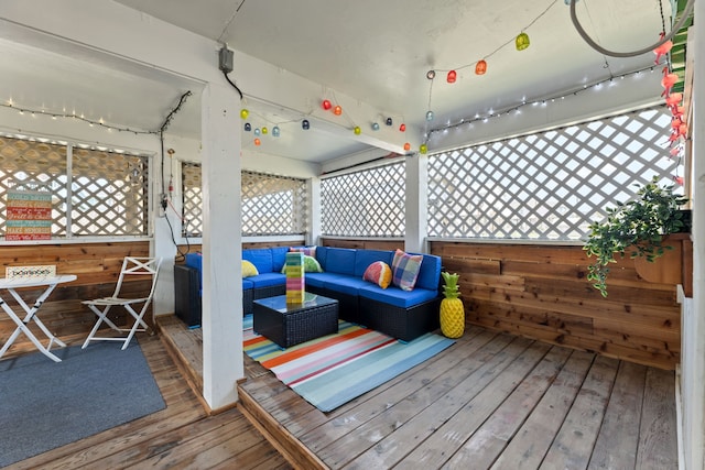 wooden terrace featuring an outdoor hangout area