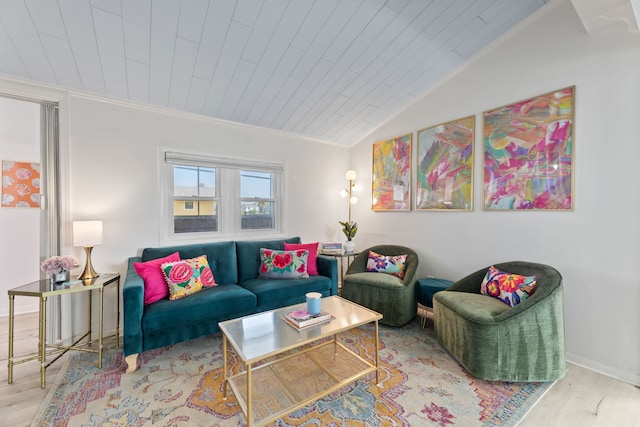 living room with crown molding, light hardwood / wood-style flooring, and wood ceiling