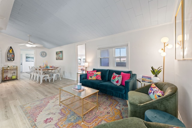 living room featuring ceiling fan, crown molding, lofted ceiling, wood ceiling, and light wood-type flooring