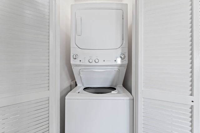 laundry room featuring stacked washer and clothes dryer