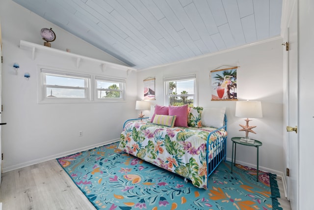 bedroom with wood ceiling, vaulted ceiling, and wood-type flooring